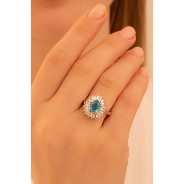 Kadın Gümüş Yüzük - Damla Model Mavi Topaz Taşlı Baget Süslemeli Rodyumlu Kadın Yüzük Kadın Gümüş Yüzük - Damla Model Mavi Topaz Taşlı Baget Süslemeli Rodyumlu Kadın Yüzük
