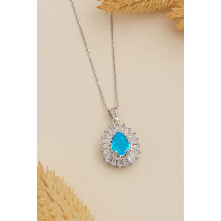Kadın Gümüş Kolye - Damla Model Mavi Topaz Taşlı Baget Süslemeli Rodyumlu Kadın Kolye Kadın Gümüş Kolye - Damla Model Mavi Topaz Taşlı Baget Süslemeli Rodyumlu Kadın Kolye