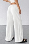 Kadın Beyaz Bol Kesim Cepli Geniş Paça Dökümlü Pantolon – Modern Ve Şık Tasarım