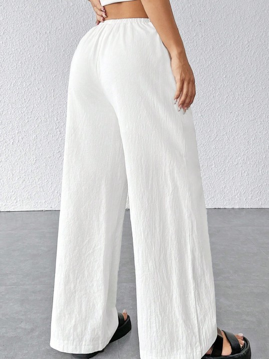 Kadın Beyaz Bol Kesim Cepli Geniş Paça Dökümlü Pantolon – Modern Ve Şık Tasarım Kadın Beyaz Bol Kesim Cepli Geniş Paça Dökümlü Pantolon – Modern Ve Şık Tasarım
