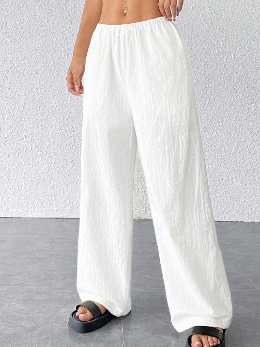 Kadın Beyaz Bol Kesim Cepli Geniş Paça Dökümlü Pantolon – Modern Ve Şık Tasarım Kadın Beyaz Bol Kesim Cepli Geniş Paça Dökümlü Pantolon – Modern Ve Şık Tasarım