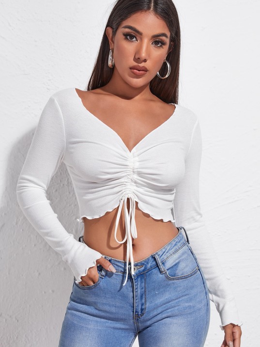 Kadın Beyaz Uzun Kollu Büzdürme Bağcık Detaylı Crop Top Bluz – Şık, Rahat ve Kolay Kombinlenebilir