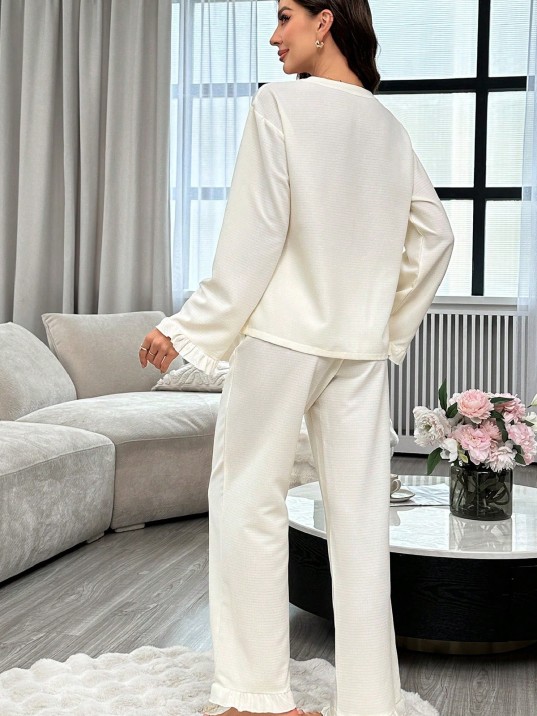 Kadın Beyaz Önden Bağlamalı Kolu Ve Paçası Fırfır Detaylı Uzun Kollu Pijama Takımı – Rahat, Şık Ve 4 Mevsim Kullanım Kadın Beyaz Önden Bağlamalı Kolu Ve Paçası Fırfır Detaylı Uzun Kollu Pijama Takımı – Rahat, Şık Ve 4 Mevsim Kullanım