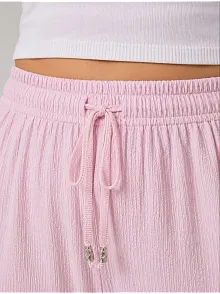 Kadın Battal Beden Bürümcük Kumaş Beli Lastikli Bağcıklı Bol Paça Palazzo Pantolon - Pembe