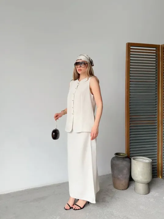 Keten Kolsuz Sıfır Yaka İlik Düğmeli Kolsuz Hırka Etek ikili Takım- Beyaz Keten Kolsuz Sıfır Yaka İlik Düğmeli Kolsuz Hırka Etek ikili Takım- Beyaz
